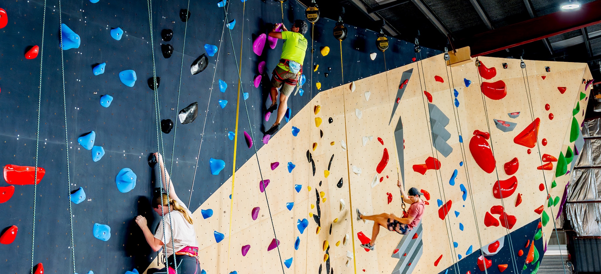 3 Climbers on a rope wall